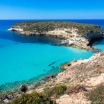 Lampedusa Island Sicily - Rabbit Beach and Rabbit Island  Lampedusa “Spiaggia dei Conigli” with turquoise water and white sand at paradise beach.